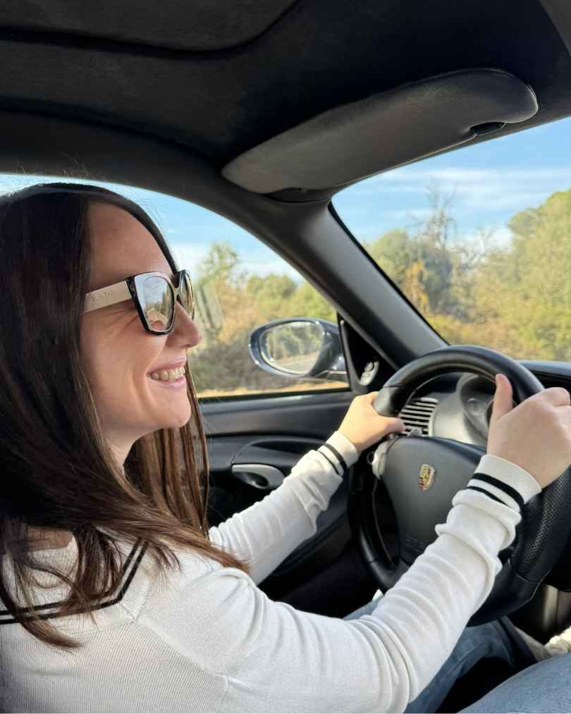 The creator driving with a smile